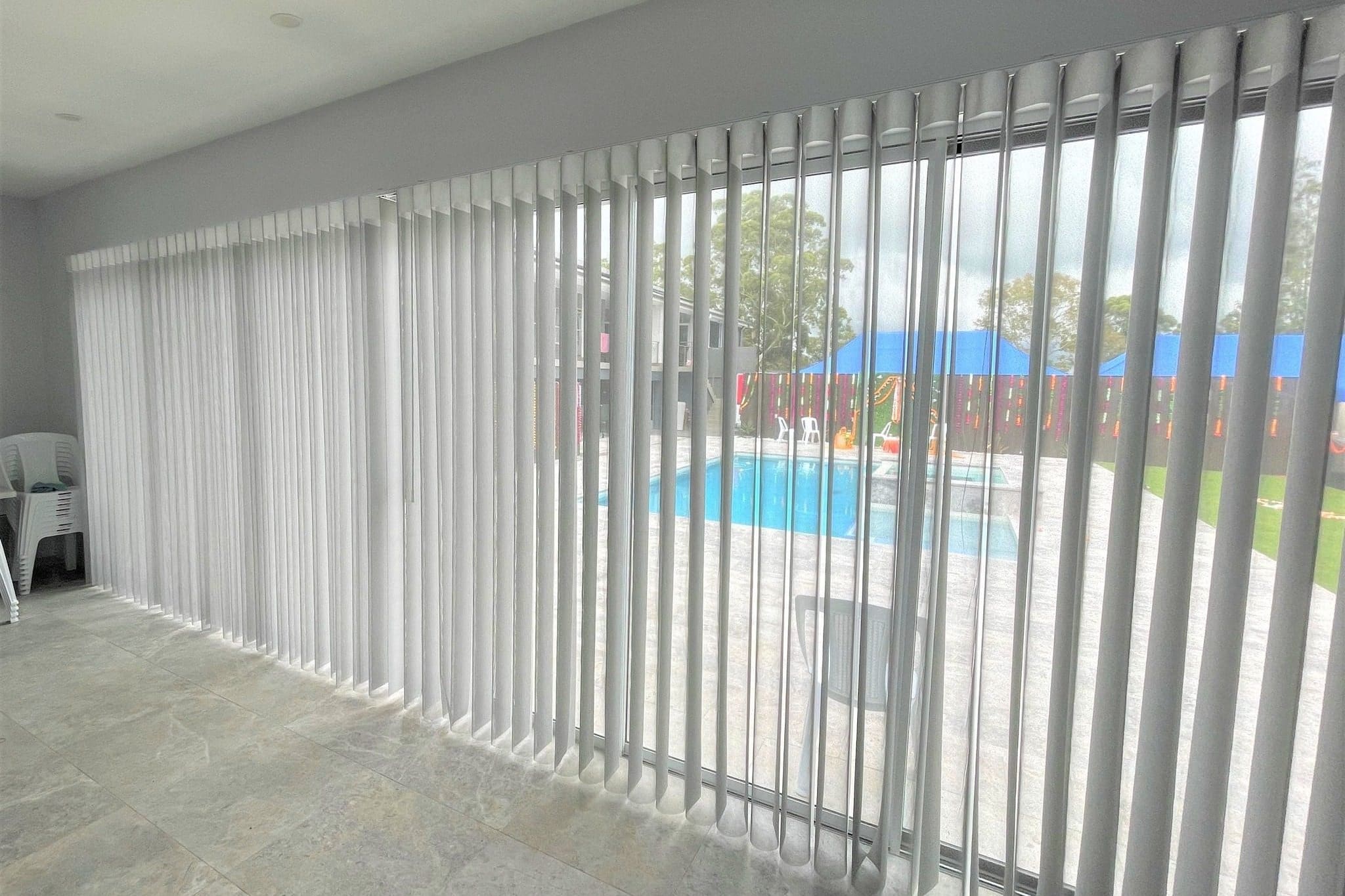Allure Breeze vertical sheer curtains across sliding doors